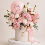 Her First Bloom – pink baby girl flowers with balloon in an Affy hat box, Dubai