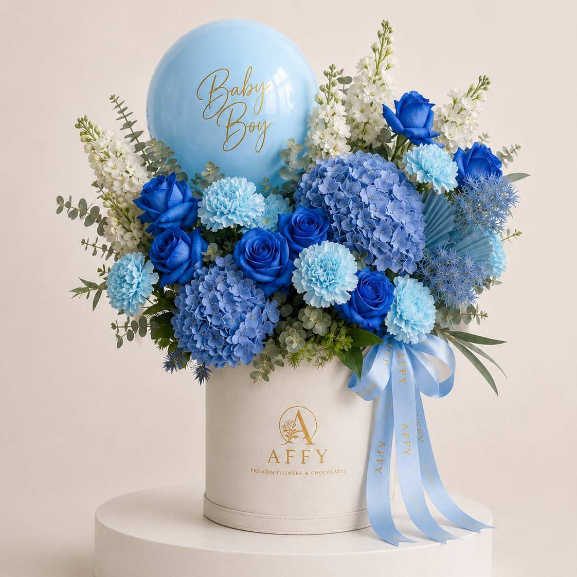His First Bloom – blue baby boy flowers with balloon in an Affy hat box, Dubai